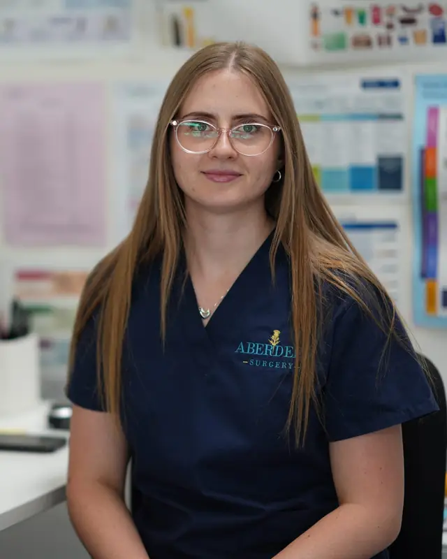 A nurse at her desk in the Aberdeen Surgery treatment room